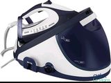 an image of a blue and white steam iron on a white background