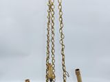 an antique brass chandelier with four arms and a black glass shade