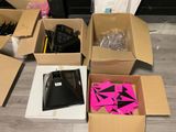 several boxes of assorted items sitting on the floor in a room