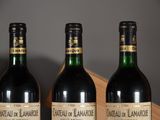 three bottles of wine that are sitting on a table