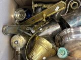 a cardboard box filled with a bunch of old items