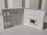 a small white box with a game inside of it
