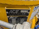 a close up of a yellow machine with a blue handle