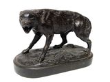 bronze statue of a dog on a wooden base on a white background