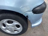 a close up of a car that has a dent in it