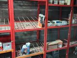 many shelves with various items on them in a room
