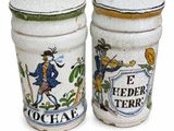 two ceramic containers that are sitting next to each other