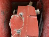 a red box that has a hose in it