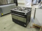 a stove that is sitting in the middle of a room