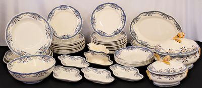 a lot of plates and bowls that are on a table