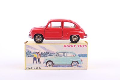 a red toy car sitting on top of a box