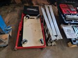 many tools and tools sitting on the floor in the garage