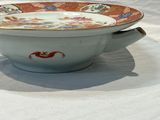 a bowl and a saucer sitting on a table