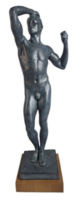 statue of a man with a raised arm on a wooden base