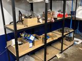many shelves with various items on them in a room
