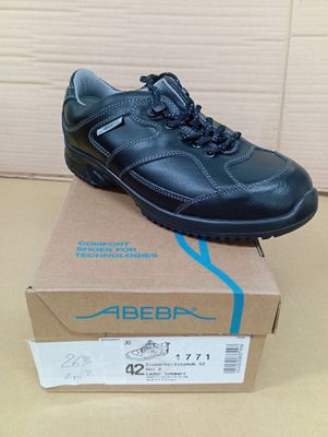 the shoe is on top of the box on the table