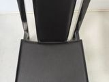 black leather dining chair with metal frame and back rest
