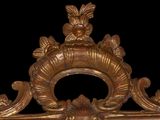 a gold frame with an ornate design on it