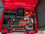 an open tool box with tools in it sitting on the floor
