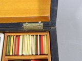 a wooden box with many different items inside of it