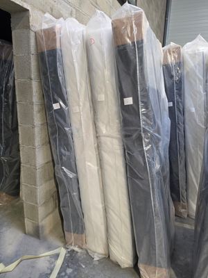 many mattresses wrapped up and ready to be shipped
