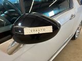 a sticker on the side mirror of a car