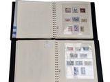 a close up of a book with stamps on it on a white background