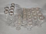 a lot of glasses that are sitting on a table