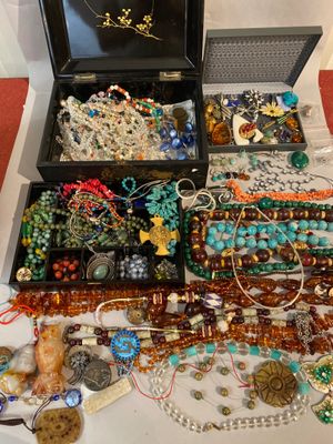 a box full of assorted jewelry on a table