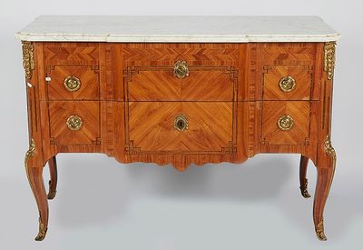 a marble top chest of drawers with a marble top