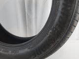 a close up of a tire on a white surface
