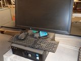 a computer on a table with a keyboard and a monitor