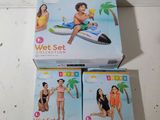 two boxes of wet set toys sitting on top of a table