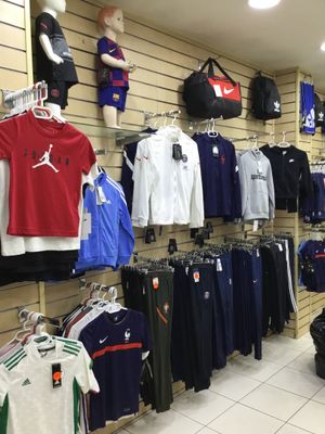 a lot of clothes on display in a store
