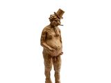 statue of a man with a top hat and a cigarette in his mouth