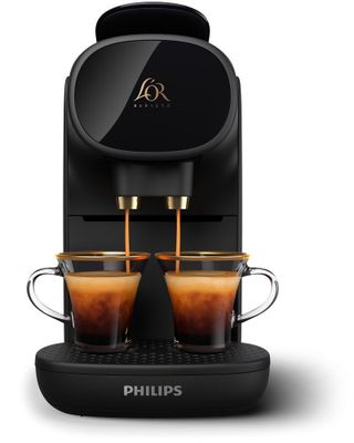 une machine à café Philips avec deux tasses de café posées devant