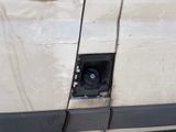 a small hole in the side of a car that has been damaged