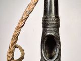 a metal object with a rope around it