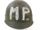 an old helmet with the word m p painted on it