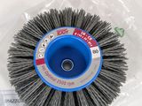 a close up of a brush on a table next to a package