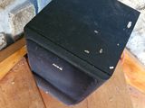 a black box sitting on top of a wooden table