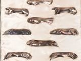 une image représentant un lot de six saucisses plaquées argent