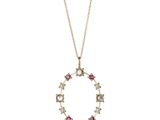 un collier en or orné de diamants roses et blancs montés sur une chaîne