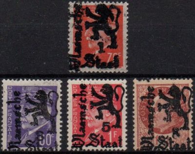 four different stamps with a lion on them on a black surface