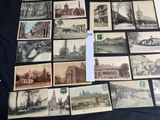 an old photo of a bunch of old postcards on a table