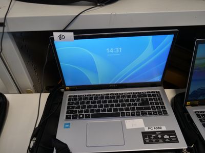 two laptops that are sitting on a desk