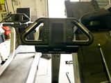 an image of a tread machine in a garage