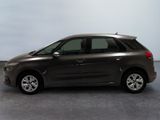 a picture of a small car parked in a garage