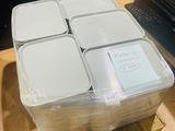 a stack of plastic containers sitting on a pallet