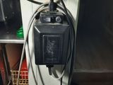 a black box with wires attached to it in a room